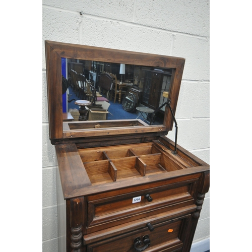 1256 - A STAINED HARDWOOD TALL CHEST OF DRAWERS, with a hinged lid, enclosing a fitted drawer, mirror and b... 