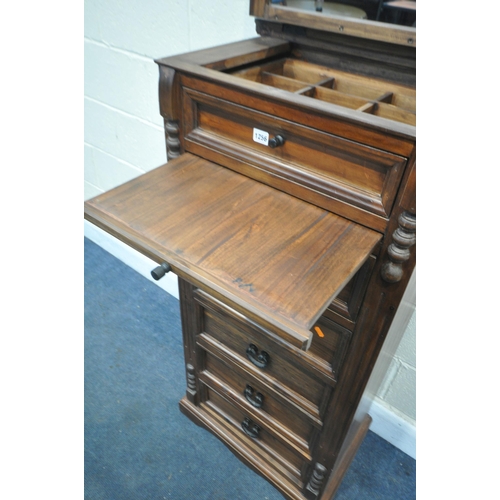 1256 - A STAINED HARDWOOD TALL CHEST OF DRAWERS, with a hinged lid, enclosing a fitted drawer, mirror and b... 