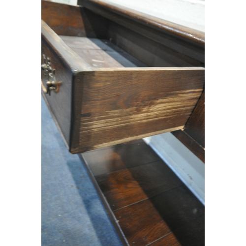 1260 - A REPRODUCTION OAK DRESSER BASE, with two drawers, on turned and block legs, united by an undershelf... 