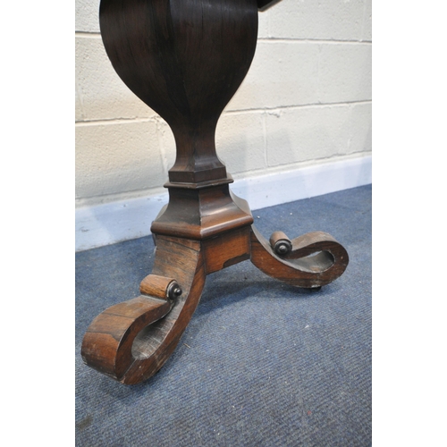 1270 - A REGENCY ROSEWOOD TEA TABLE, the swivel fold over top, with rounded corners, foliate decoration to ... 