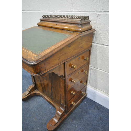 1272 - A LATE VICTORIAN WALNUT AND MARQUETRY INLAID DAVENPORT, with a pierced brass gallery, a green leathe... 