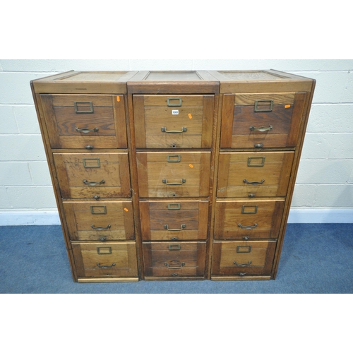 1303 - A SET OF THREE EARLY TO MID 20TH CENTURY OAK FILING CABINETS, four drawers to each cabinet, a total ... 