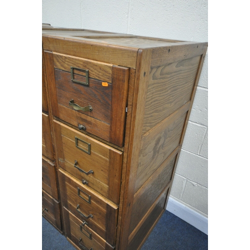 1303 - A SET OF THREE EARLY TO MID 20TH CENTURY OAK FILING CABINETS, four drawers to each cabinet, a total ... 