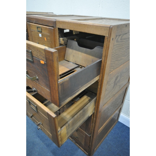 1303 - A SET OF THREE EARLY TO MID 20TH CENTURY OAK FILING CABINETS, four drawers to each cabinet, a total ... 