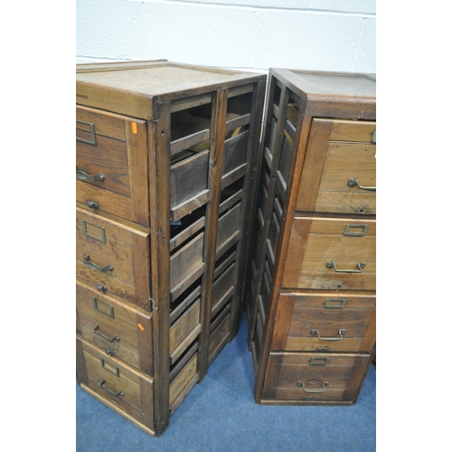 1303 - A SET OF THREE EARLY TO MID 20TH CENTURY OAK FILING CABINETS, four drawers to each cabinet, a total ... 