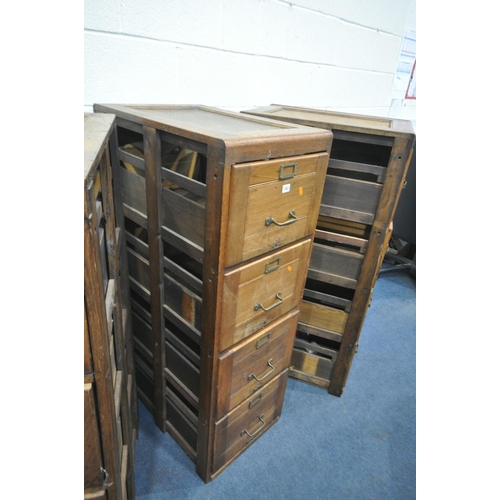 1303 - A SET OF THREE EARLY TO MID 20TH CENTURY OAK FILING CABINETS, four drawers to each cabinet, a total ... 