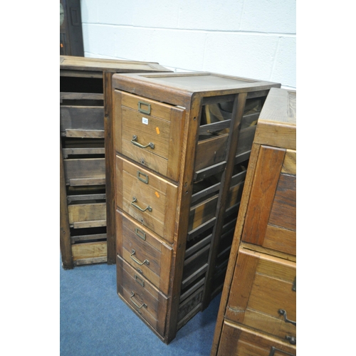 1303 - A SET OF THREE EARLY TO MID 20TH CENTURY OAK FILING CABINETS, four drawers to each cabinet, a total ... 