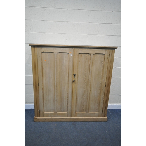 1306 - A 19TH CENTURY PITCH PINE PANELLED DOUBLE DOOR CUPBOARD, enclosing three fixed shelves, width 153cm ... 