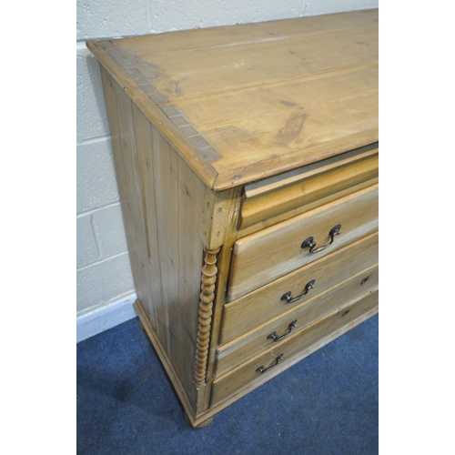 1308 - A 19TH CENTURY FRENCH PINE CHEST OF FIVE DRAWERS, with a single frieze drawer, swan neck handles, on... 