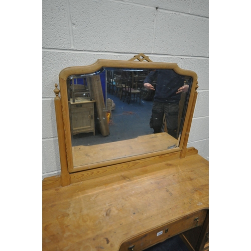 1311 - A 19TH CENTURY PINE DRESSING TABLE, with a single mirror, with a panelled cupboard doors flanking a ... 