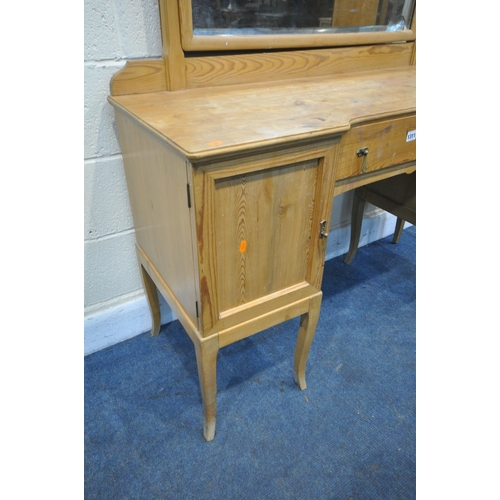 1311 - A 19TH CENTURY PINE DRESSING TABLE, with a single mirror, with a panelled cupboard doors flanking a ... 