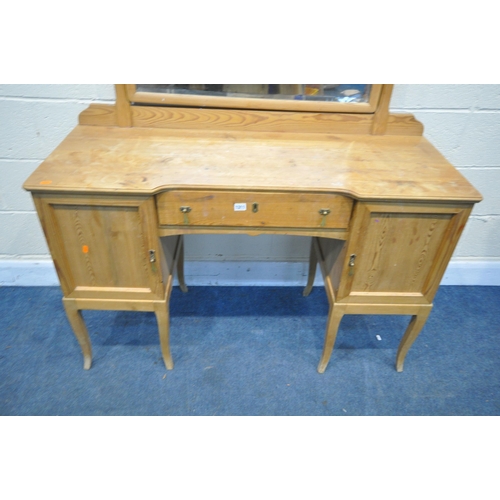 1311 - A 19TH CENTURY PINE DRESSING TABLE, with a single mirror, with a panelled cupboard doors flanking a ... 