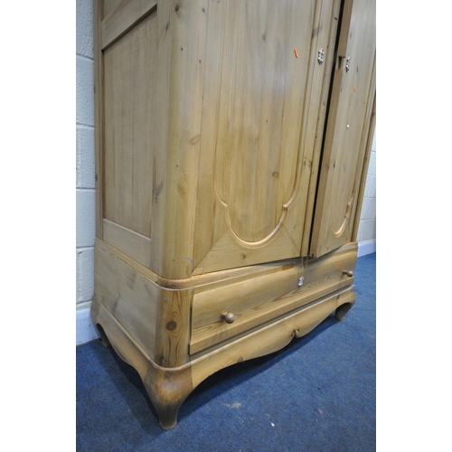 1314 - A 19TH CENTURY FRENCH PINE PANELLED TWO DOOR WARDROBE, above a single long drawer, width 117cm x dep... 