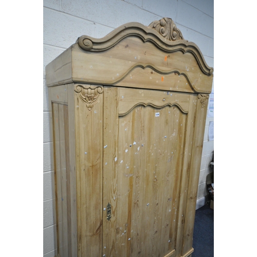 1316 - A FRENCH PINE PANELLED SINGLE DOOR ARMOIRE, with a foliate shaped cornice, and a single drawer, widt... 