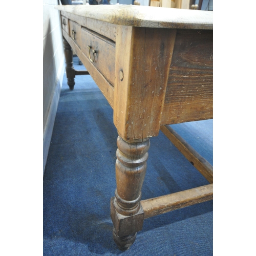 1321 - A LARGE 19TH CENTURY PINE FARMHOUSE TABLE, with three full length frieze drawers, on block and turne... 