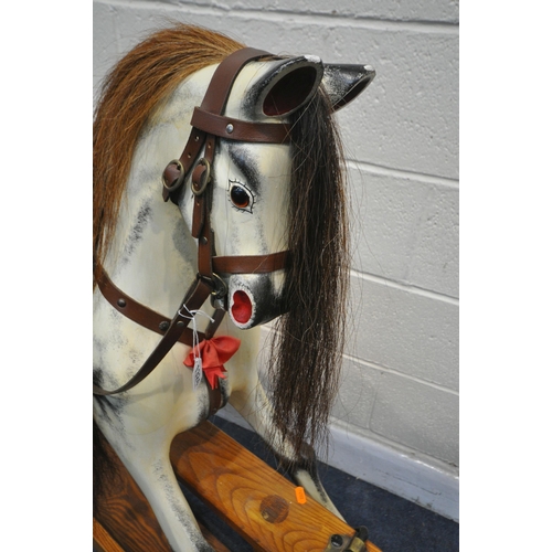 1324 - IN THE MANNER OF FH AYRES, a Victorian style dappled painted rocking horse, with brown studded leath... 