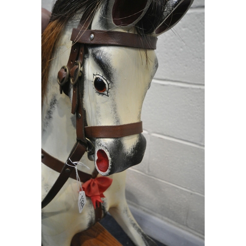 1324 - IN THE MANNER OF FH AYRES, a Victorian style dappled painted rocking horse, with brown studded leath... 