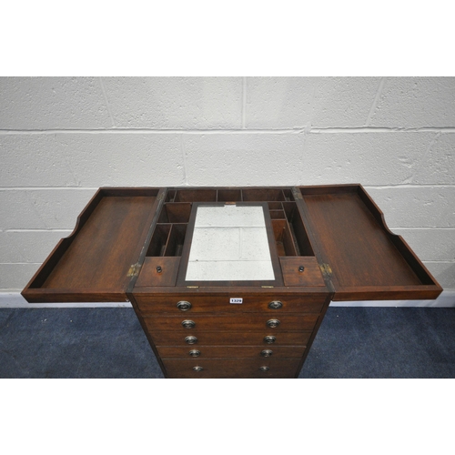 1329 - A GEORGIAN MAHOGANY GENTLEMANS WASHSTAND, the double flap top enclosing an arrangement of pigeon hol... 