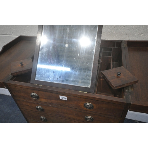 1329 - A GEORGIAN MAHOGANY GENTLEMANS WASHSTAND, the double flap top enclosing an arrangement of pigeon hol... 