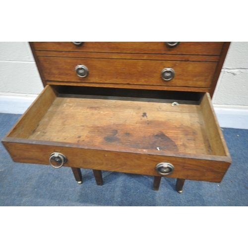 1329 - A GEORGIAN MAHOGANY GENTLEMANS WASHSTAND, the double flap top enclosing an arrangement of pigeon hol... 