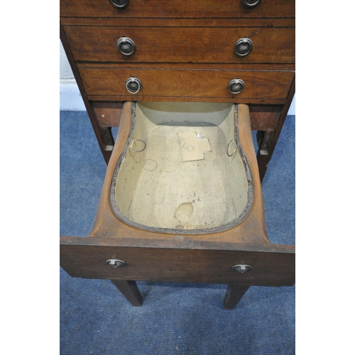 1329 - A GEORGIAN MAHOGANY GENTLEMANS WASHSTAND, the double flap top enclosing an arrangement of pigeon hol... 