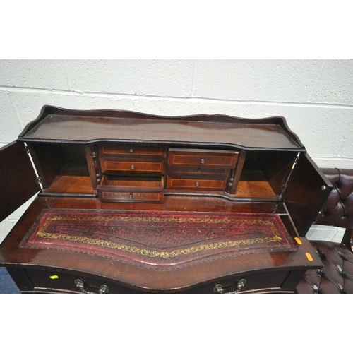 1339 - A 20TH CENTURY MAHOGANY CAPTAINS DESK, the raised back with two doors, flanking two banks of three d... 