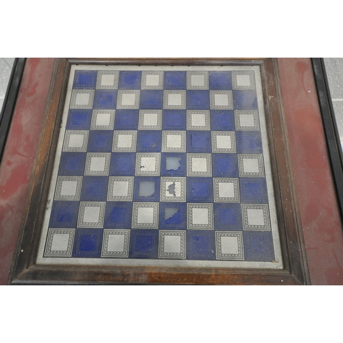 1347 - A MODERN CHESS TABLE, with a blue and silver chess board, a red perimeter, metal chess pieces, with ... 