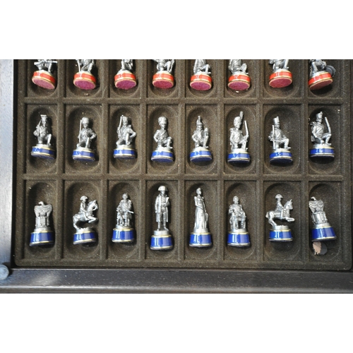 1347 - A MODERN CHESS TABLE, with a blue and silver chess board, a red perimeter, metal chess pieces, with ... 