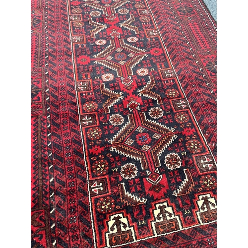 1361 - A 20TH CENTURY RED GROUND HAMADAN RUG, 193cm x 104cm (condition:-good condition)