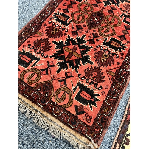 1363 - A 19TH CENTURY PERSIAN HOSSEINABAD CARPET RUNNER, red field, central cream medallion, length 284cm x... 