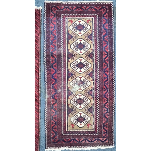 1366 - A 20TH CENTURY IRANIAN RED GEOMETRIC PATTERNED RUG, 193cm x 111cm, and a red tekke rug, 200cm x 96cm... 