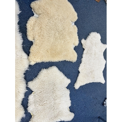 1371 - TWO LARGE FAUX SHEEP SKIN RUGS, 185cm x 151cm, and three small sheep skin rugs (5)