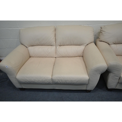 1377 - A PAIR OF CREAM LEATHERETTE TWO SEATER SOFAS, length 155cm (condition - signs of wear and dirt)