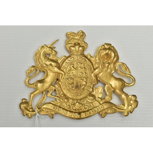 740A - A VICTORIAN EMBOSSED GILT METAL ROYAL COAT OF ARMS BADGE, with motto Dieu Et Mon Droit, height 10.3c... 