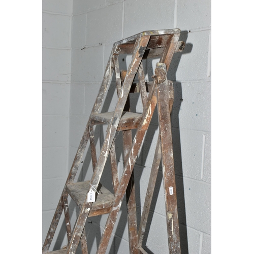 742A - A SET OF VINTAGE WOODEN STEP LADDERS, bearing cast iron 'TRADE MARK CAJAC' mounts to both sides, clo... 