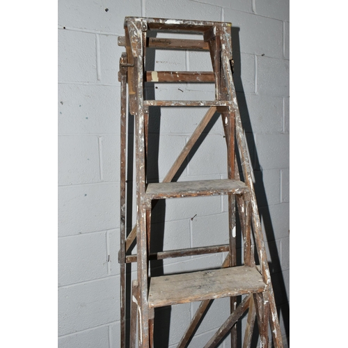 742A - A SET OF VINTAGE WOODEN STEP LADDERS, bearing cast iron 'TRADE MARK CAJAC' mounts to both sides, clo... 