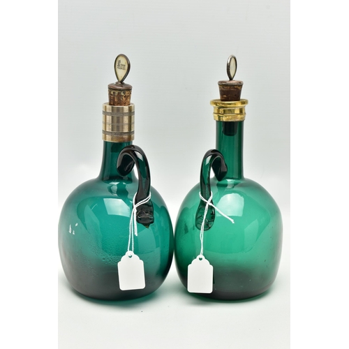 808A - TWO VICTORIAN GREEN GLASS DECANTERS WITH METAL MOUNTS AND LOOP HANDLES, both with an ill-fitting mot... 