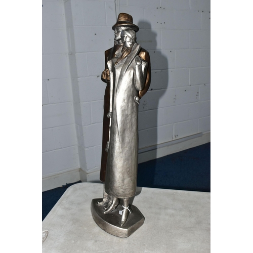 841A - A LATE 20TH CENTURY AUSTIN PROD INC PLASTER SCULPTURE OF AN ART DECO STYLE LADY AND GENTLEMAN, gilt ... 