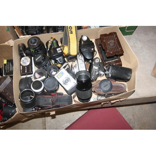 856 - FOUR TRAYS CONTAINING CAMERAS AND EQUIPMENT including a Nikon F50 with 28-70mm lens, a Voigtlander V... 