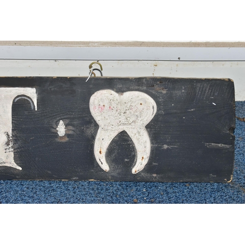 863A - A 19TH CENTURY WOODEN BOARD LATER PAINTED AS A 'DENTIST' SIGN, with applied wooden tooth to either e... 