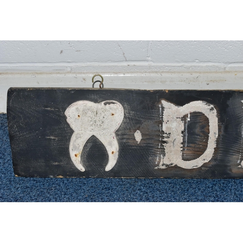 863A - A 19TH CENTURY WOODEN BOARD LATER PAINTED AS A 'DENTIST' SIGN, with applied wooden tooth to either e... 