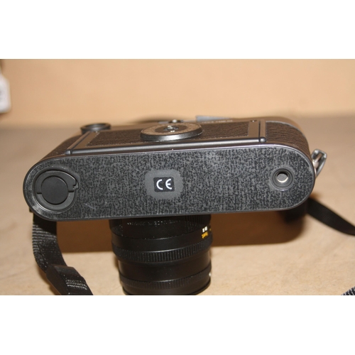 865 - A LEICA M6 FILM CAMERA serial No 2755787 in black fitted with a Semikron M 50mm f2 lens with cap and... 