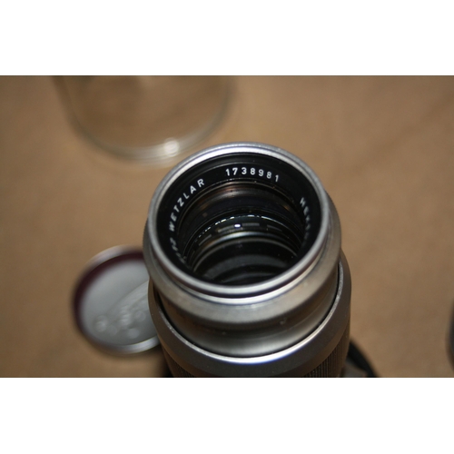 867 - A LEITZ SUMMARIT 5cm f1.5 SCREW FIT LENS with front and back caps along with a Hektor 135mm f4.5 bay... 