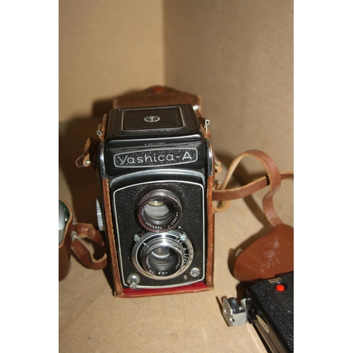 876 - A TRAY CONTAINING FILM CAMERAS INCLUDING A Yashica A TLR camera in tatty leather case, a Werra Mat S... 