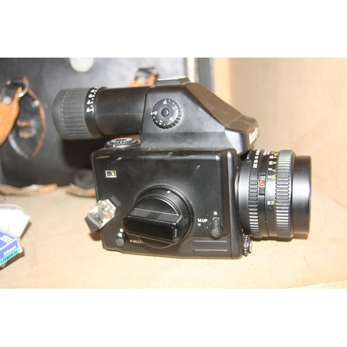 881 - A MAMIYA M645E MEDIUM FORMAT CAMERA fitted with a Secor C 80mm f2.8 lens, three filters and a case C... 