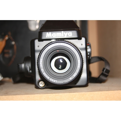 881 - A MAMIYA M645E MEDIUM FORMAT CAMERA fitted with a Secor C 80mm f2.8 lens, three filters and a case C... 