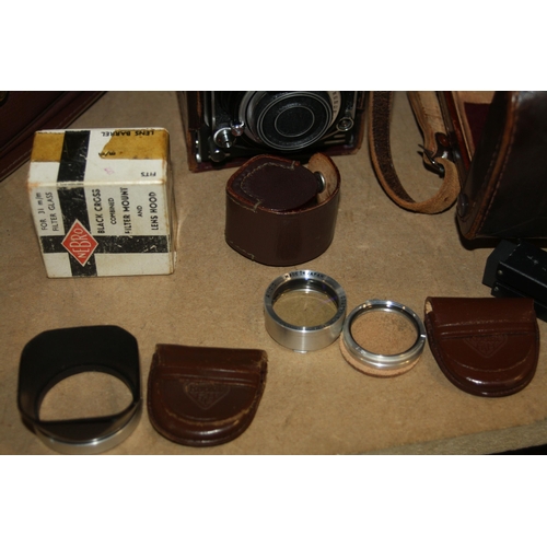 882 - A MINOLTA AUTOCORD TLR CAMERA Serial No 361332 fitted with Rokkor 75mm f3.2 and f3.5 lenses, leather... 