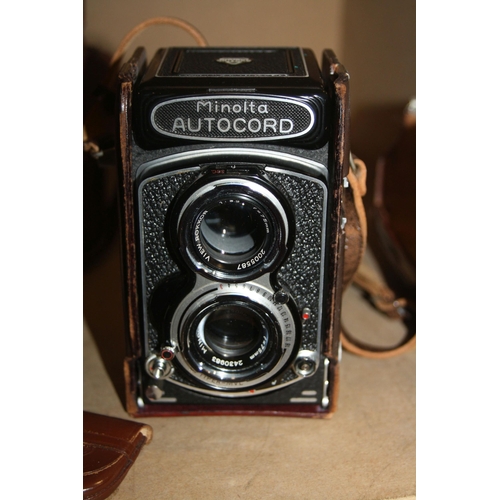 882 - A MINOLTA AUTOCORD TLR CAMERA Serial No 361332 fitted with Rokkor 75mm f3.2 and f3.5 lenses, leather... 