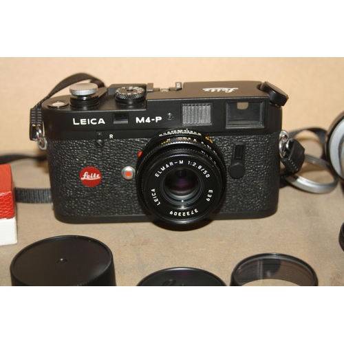 883 - A LEICA M4P FILM CAMERA in black Serial No 1547392 fitted with an Elmar M 50mm f2.8 lens, an Elmar 9... 