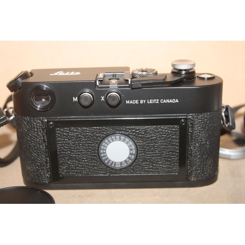 883 - A LEICA M4P FILM CAMERA in black Serial No 1547392 fitted with an Elmar M 50mm f2.8 lens, an Elmar 9... 